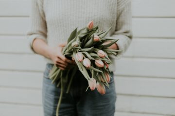 mother-holding-flowers-for-mothers-day