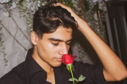 man-smelling-valentines-rose
