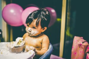 Small Boy Eating Messy Cake