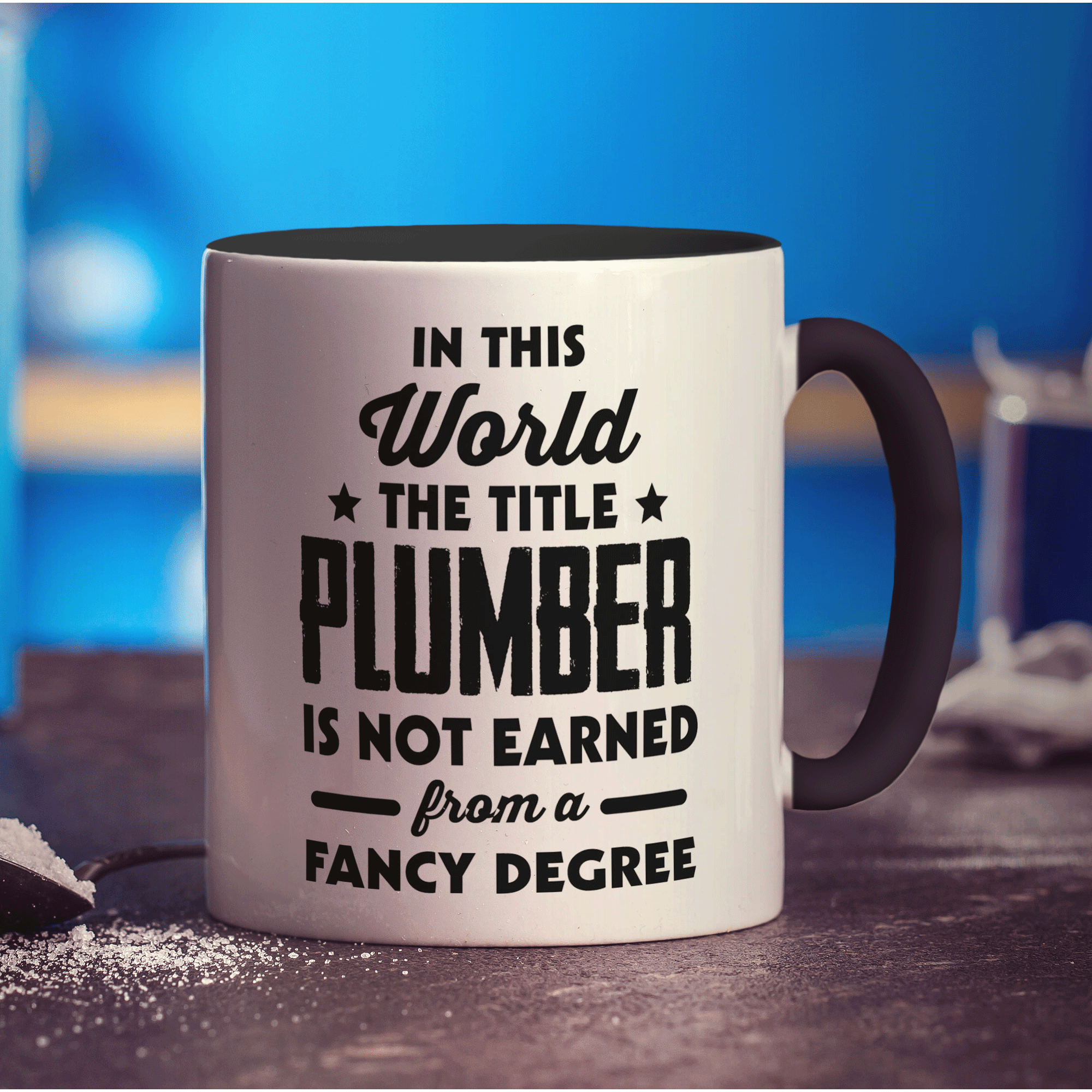 In This World The Title Plumber Is Not Earned From a Fancy Degree Mug - Standard 330ml (11oz) / Black