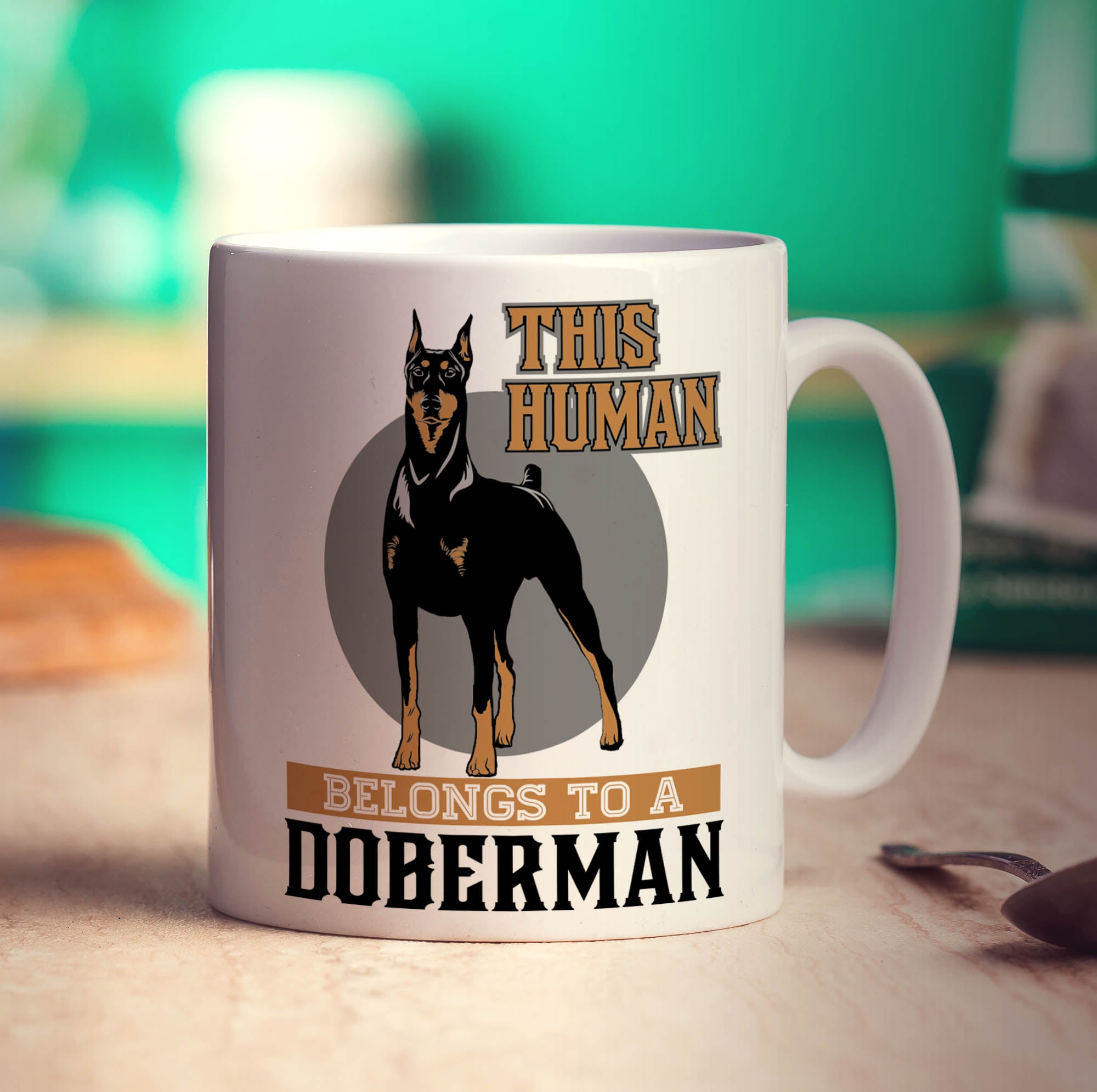 This Human Belongs To A Doberman Mug